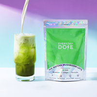 10-Pack of Mushroom Matcha+ pouch next to iced matcha latte with milk pouring, showcasing smooth creamy beverage.