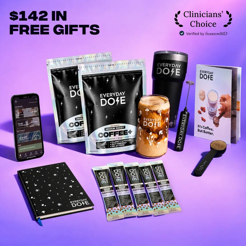 Everyday Dose coffee and cocoa packets with tumbler glass jar scoop notebook phone and promotional gift card on purple background