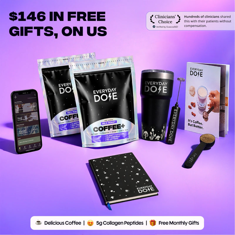 Everyday Dose coffee bags with a black tumbler scoop notebook and phone displayed on a vibrant purple background