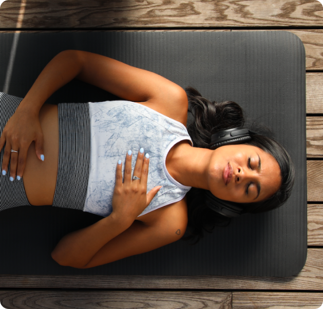 girl laying down on yoga mat