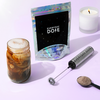 90 Servings Coffee Kit with mushroom coffee packet, frother, mason jar of prepared coffee and candle on purple background