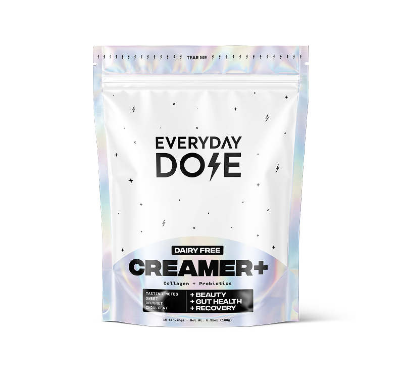 White resealable pouch with holographic accents labeled Everyday Dose Dairy Free Creamer Plus, featuring collagen and probiotics, with benefits for beauty, gut health, and recovery.