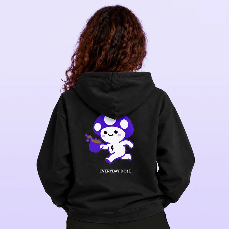 Model viewed from behind wearing a black hoodie with a purple and white cartoon graphic and Everyday Dope lettering against a lavender backdrop