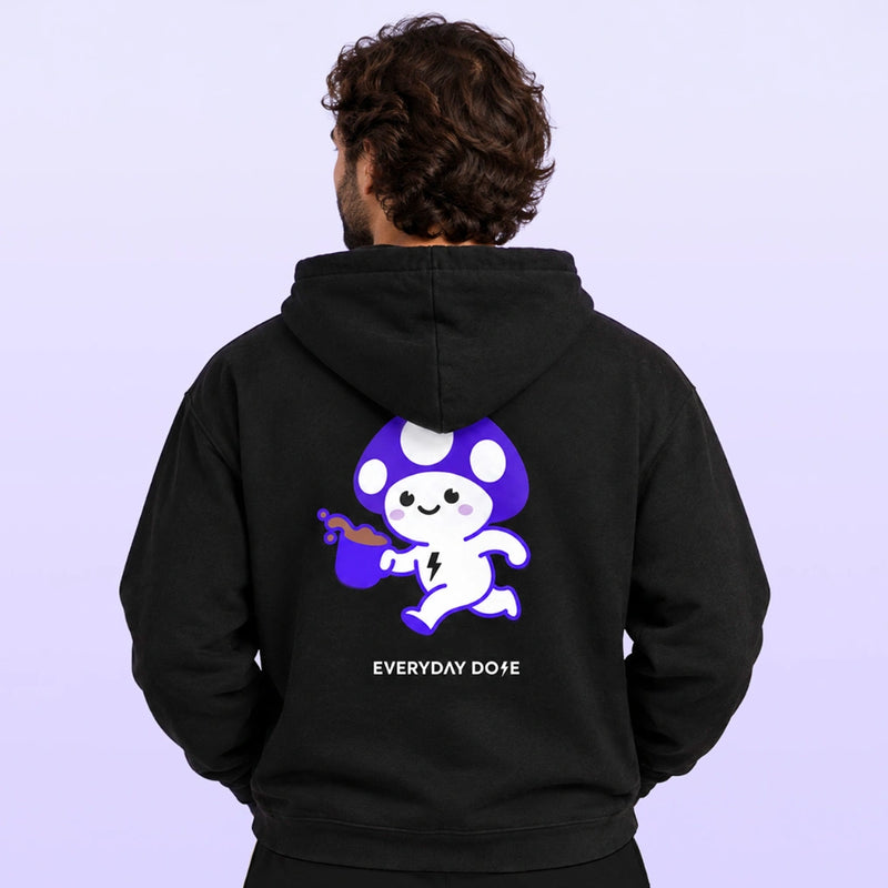 Back view of a man wearing a black hoodie with a purple and white astronaut graphic and Everyday Dope text against a lavender background