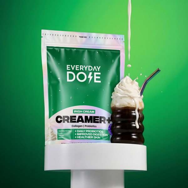 Packet of Irish Cream creamer with whipped cream-topped dark coffee and milk pouring against green background