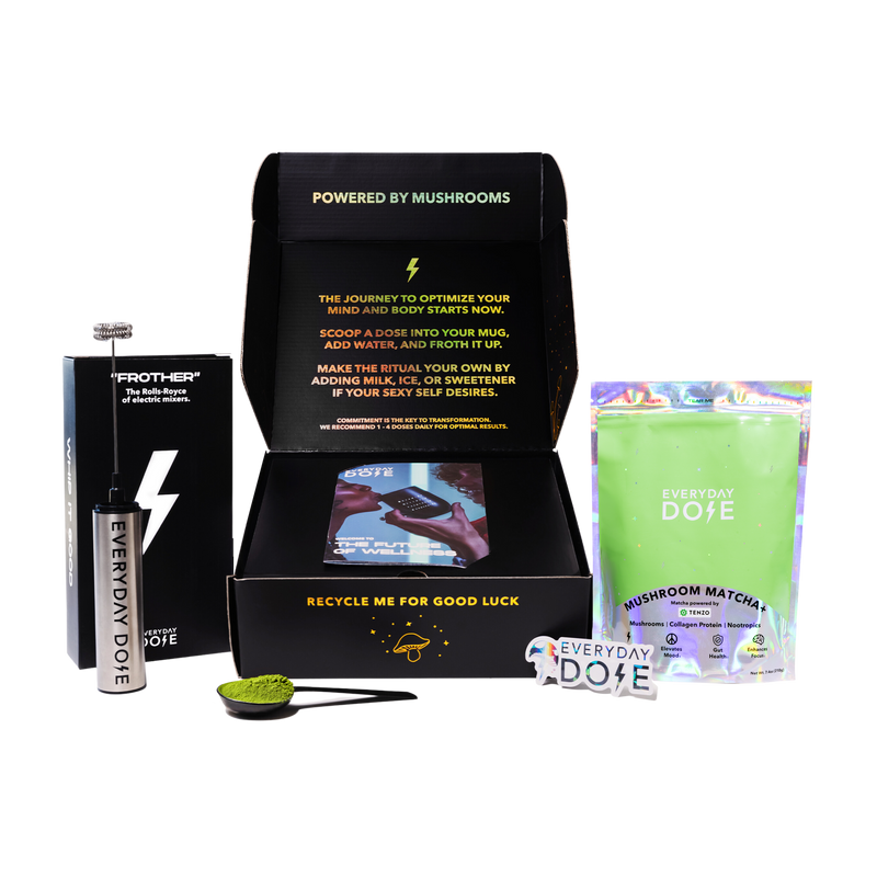 Mushroom Matcha starter kit with black box, green powder packet and metal water bottle against white background