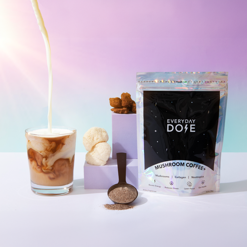 90 Serving Jumbo Bag of mushroom coffee with milk pour, powder scoop, and treats against pastel background